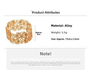 Detailed view of matte gold cutout floral bangle with geometric hollow metal design