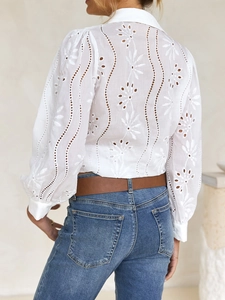 Detailed back view of white lace hollow-out embroidery blouse with puff sleeves