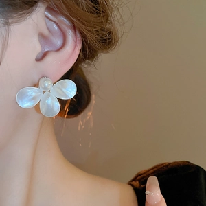 Elegant floral pearl stud earrings with shimmering white petals and a pearl center for women