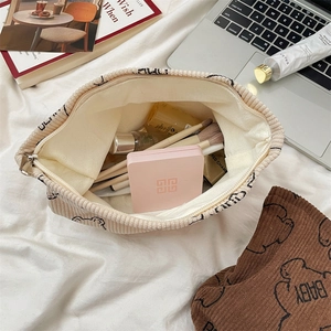 Corduroy makeup bags with cute bear prints showing spacious storage for cosmetics
