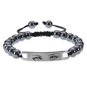 Macro shot of hematite beaded bracelet with custom photo engraved on steel bar