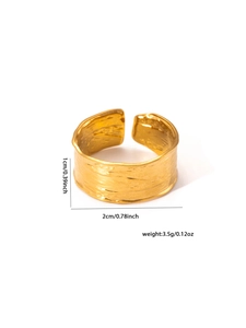 Detail of 18k gold plated titanium ring with hammer texture and 1cm width scale