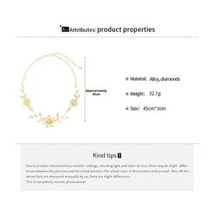 Detailed view of golden leaf necklace with rhinestones showing 45cm length and 3cm width