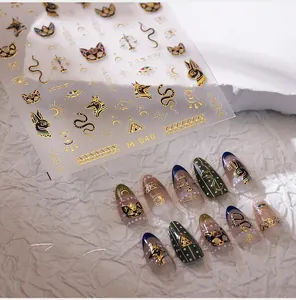 Detailed M-640 gold embossed nail stickers featuring Egyptian Anubis and Eye of Horus