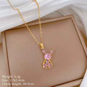 Detail of pink crystal rabbit pendant in gold finish with technical dimensions