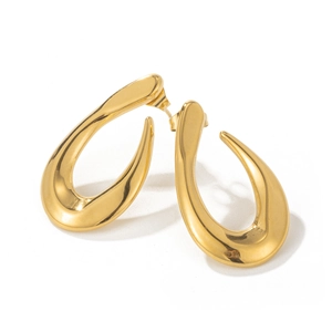 Modern polished gold teardrop earrings with a geometric curved design on white background