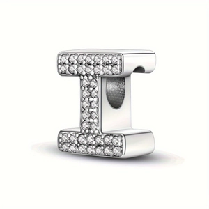 Macro view of a silver letter I bead charm with sparkling pavé-set clear cubic zirconia