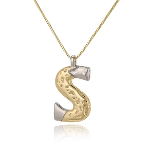 Macro view of two-tone letter S pendant necklace with golden hammered texture and silver tips