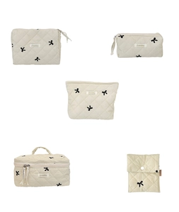 Quilted cotton organizer set with black bow embroidery including makeup bags and pouches