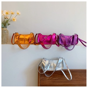 Metallic Y2K shoulder bags in orange, pink, purple and silver with studded straps