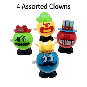 Set of 4 clockwork jumping clown toys with pirate, smiley, and crown hat designs