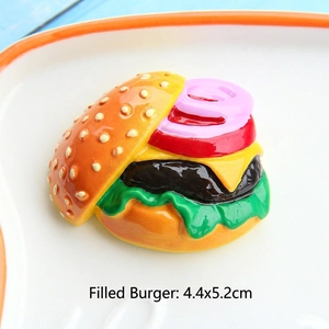 Macro detail of a 4.4x5.2cm miniature stuffed burger replica with realistic layers