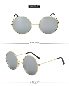 Detail of vintage round sunglasses with gold metal frame and silver mirrored lenses