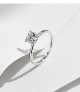 Macro shot of 1ct princess cut moissanite set in classic four-prong silver ring