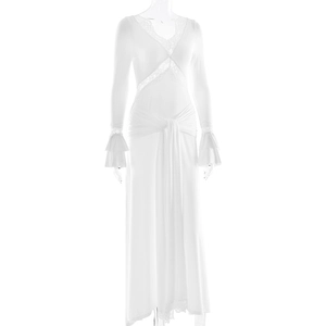 Detailed view of the white lace V-neckline and elegant waist tie of the long dress