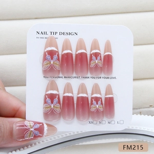 Long stiletto press-on nails with red gradient, butterfly art, and French cat-eye finish