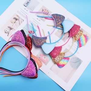 Flat lay of colorful cat ear headbands with glitter sequins and princess style accents