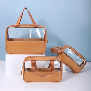 Three transparent brown PVC cosmetic bags in different sizes with PU leather accents