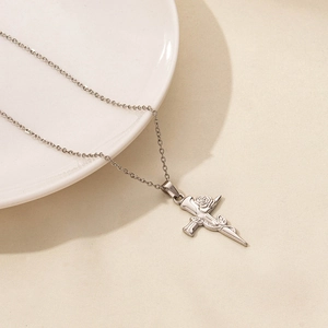 Detailed top view of a silver cross pendant with an intricate rose flower wrapping around it