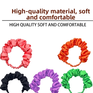 Set of five colorful satin scrunchies in red, orange, black, purple, and green