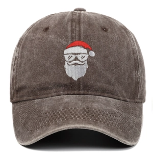 Detailed embroidery of Santa Claus wearing sunglasses on a retro washed baseball cap