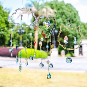 Detailed trio of crystal suncatchers with gold cloud, heart, and cat motifs and colorful stones