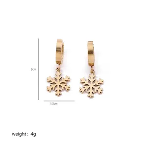Detailed view of gold snowflake hoop earrings with 3cm height and 4g weight dimensions