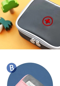 Detail of travel medical pouch showing durable waterproof fabric and red cross symbol