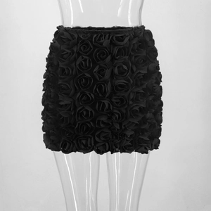 Detail view of 3D rose flower texture on a black sexy mini skirt for women