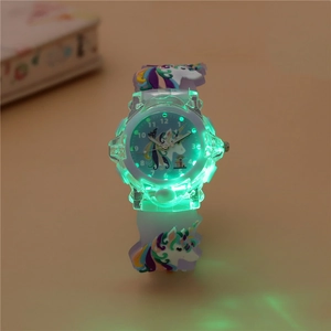 Macro detail of kids quartz watch with luminous unicorn dial and glowing LED feature