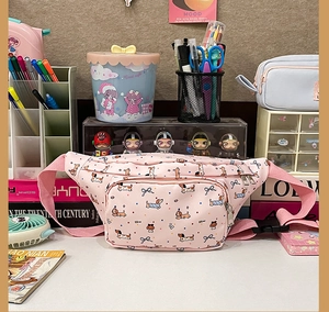 Detailed view of a pink cartoon dog waist bag with multi-pocket design and adjustable strap