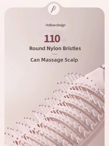 Detail of 110 round nylon teeth and hollow design on this pink massaging hairbrush