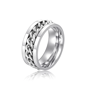 Detailed macro view of rotating cuban chain inlay on industrial silver steel ring