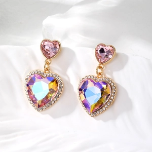 Detail of aurora crystal heart earrings with pink stones and pavé cubic zirconia