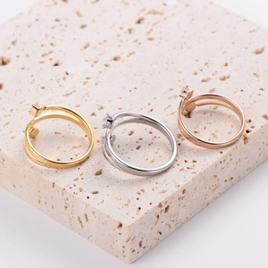 Minimalist triple-band stacked ring set with cubic zirconia in gold, silver, and rose gold