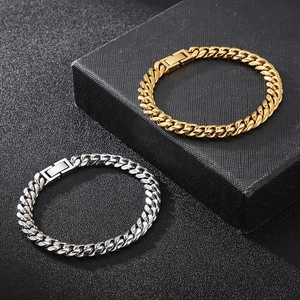 Mens hiphop Cuban link bracelets in gold and silver finish with secure clasp on black background