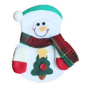 Close-up of a snowman cutlery holder made of felt with festive red and green scarf detail