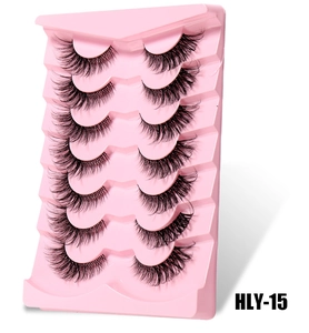 Close-up detail of 7 pairs of Fox-style DIY false eyelashes on a pink tray