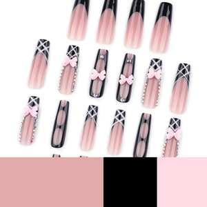 Extra-long square French nails with black and pink bows and rhinestones