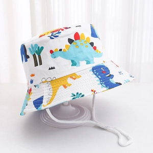 Detail of kids cotton sun hat featuring colorful dinosaur prints and adjustable chin strap