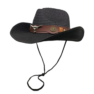 Black western straw cowboy hat with brown leather band and silver bull skull ornament