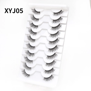 Detailed view of 10 pairs of black cat eye eyelashes in white tray model XYJ05