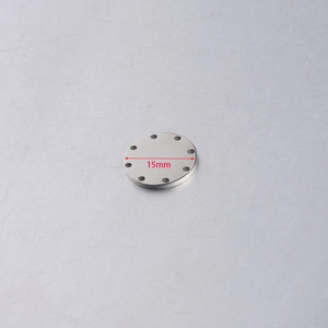Macro shot of 15mm mirror polished stainless steel disc pendant with multiple holes