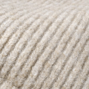 Close-up of thick ribbed knit fabric for winter beanies in warm oatmeal heather color