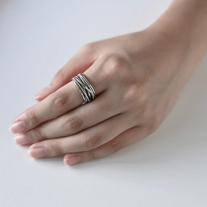 Retro multi-layer twisted open ring in S925 sterling silver worn by a model