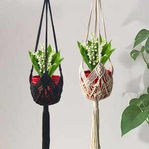 Handwoven macrame plant hangers in black and beige cotton rope for balcony home decoration