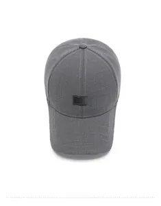 Top-down view of dark grey baseball cap showing textured fabric and square logo patch