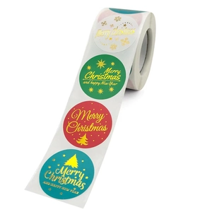 Roll of Christmas and New Year stickers with gold foil Merry Christmas tree designs