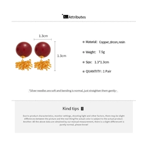 Detailed product specifications for 18k gold plated dark red resin firework earrings