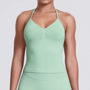 Detail of light green seamless yoga top with neck halter and pleated chest design